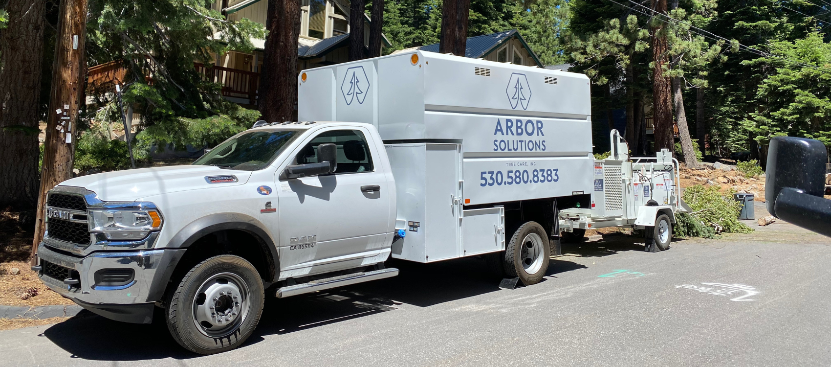 The Arbor Solutions wood chipper parked in front of a job site in Truckee, CA.